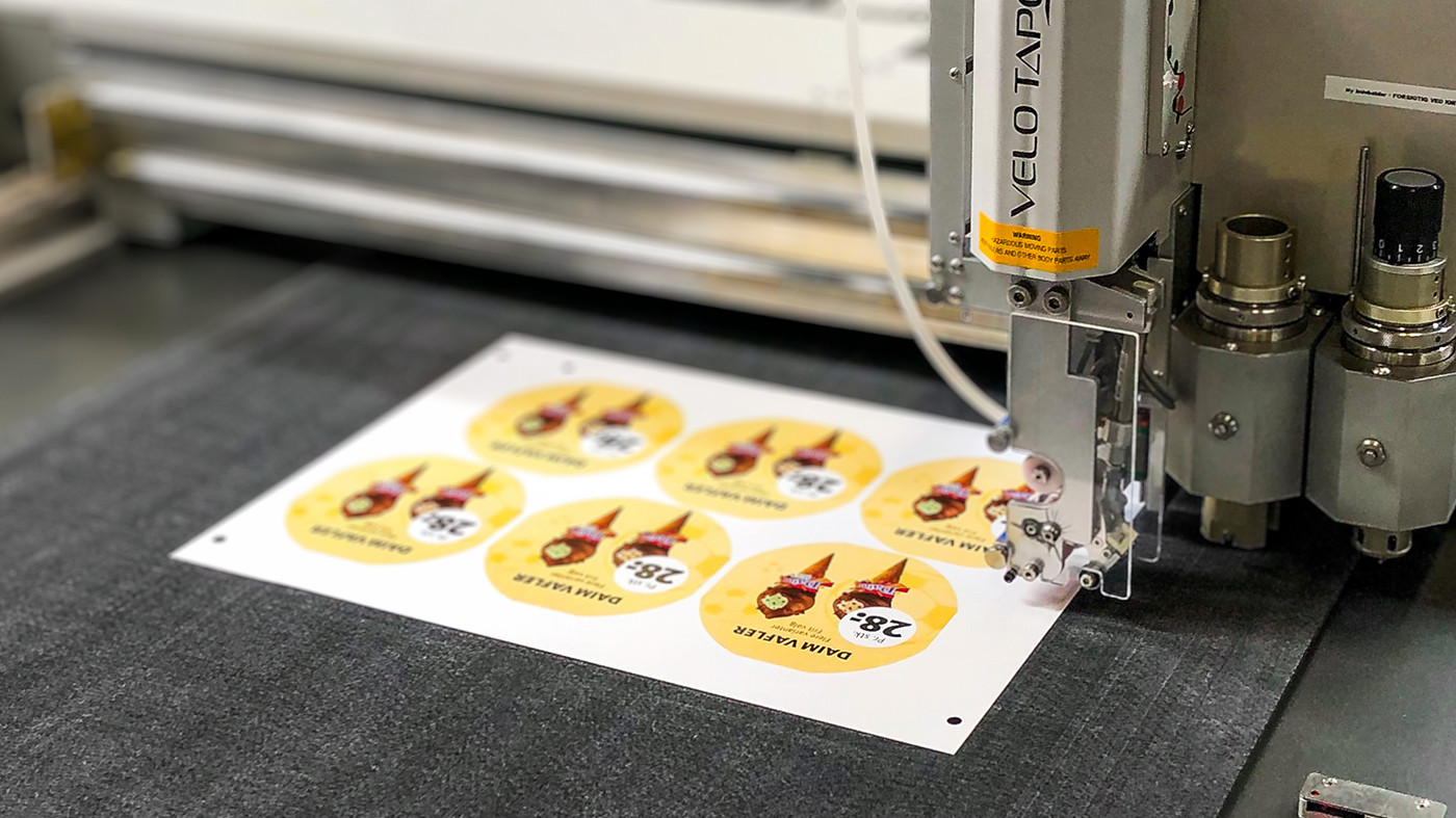 Udskæring af kampagnematerialer til OK Plus